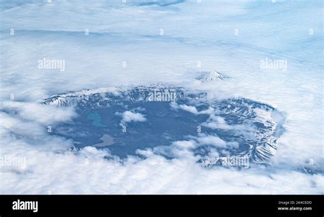 An aerial of the Tulik Volcano behind the Okmok Caldera Rim on the ...