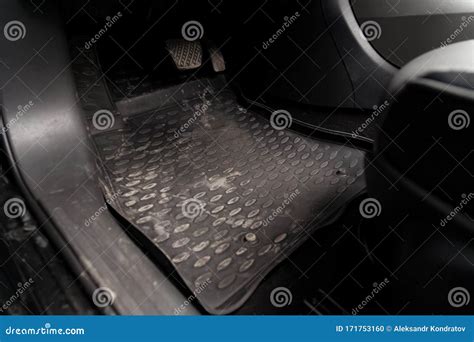 Dirty Car Floor Mats of Rubber with Gas Pedals and Brakes in the ...