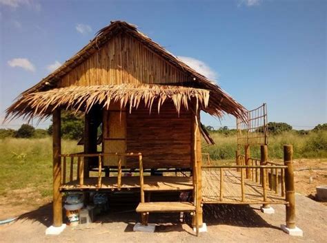 a small hut made out of wood and straw