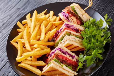 Delicious Classic Club Sandwich with French Fries Stock Photo - Image ...