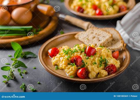 Scrambled eggs with herbs stock image. Image of background - 108180369