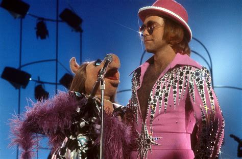 Elton John Style Evolution: Fashion Photos From 1970s to Now