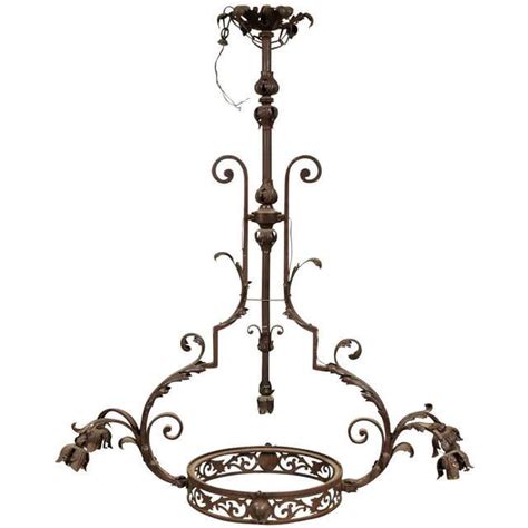 Hand-Forged Wrought Iron, Four-Arm Chandelier at 1stDibs