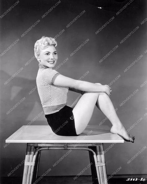 cute Laurie Mitchell in short shorts stiing on a table 8b20-0369 ...