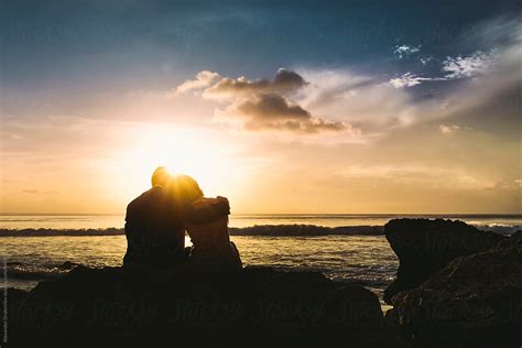 "Young Couple At Sunset Beach" by Stocksy Contributor "Alexander ...