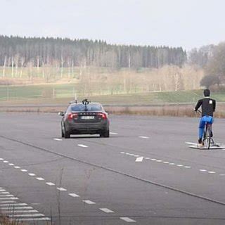 Test track scenario with ego vehicle (black), robot cyclist, and robot ...