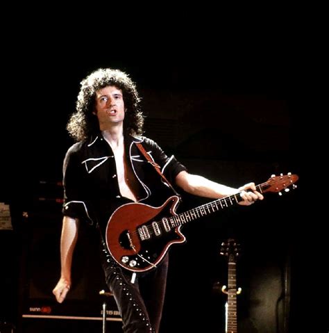 Brian May on stage with his guitar Red Special Queen Brian May, I Am A ...