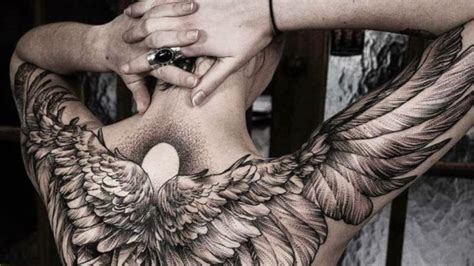 Aggregate more than 63 guardian angel back tattoo super hot - in.coedo ...