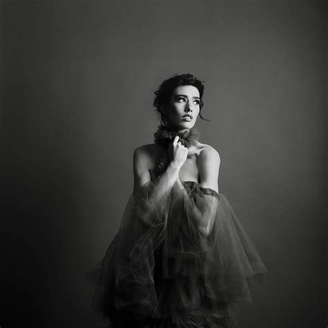 Classic studio fashion editorial on black and white film with a tulle dress