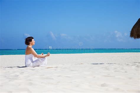 Meditation on the beach stock photo. Image of girl, positive - 13436358