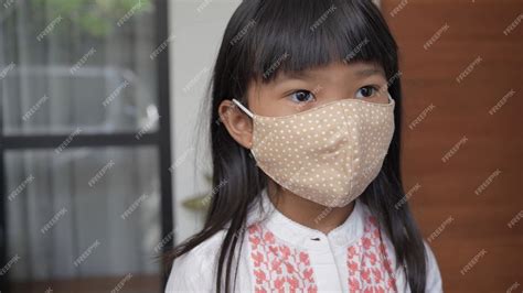 Premium Photo | Kids wearing the mask for protect them self from virus ...