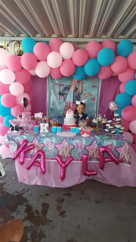 a birthday party with balloons and decorations