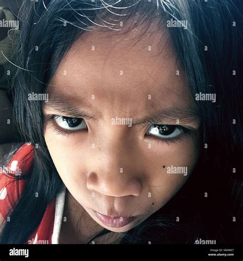 A little girl's angry face Stock Photo - Alamy