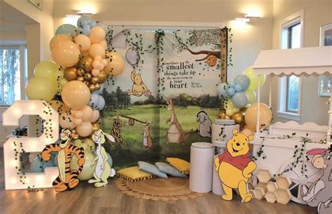 winnie the pooh birthday party with balloons and decorations