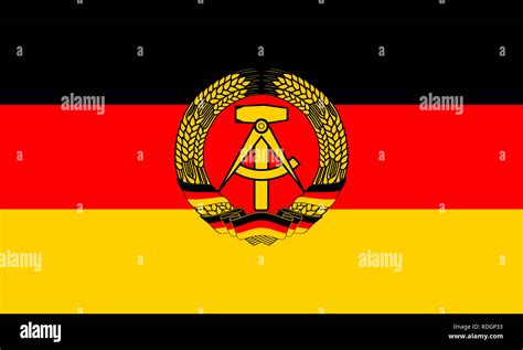 Flag of the German Democratic Republic with coat of arms Stock Photo ...