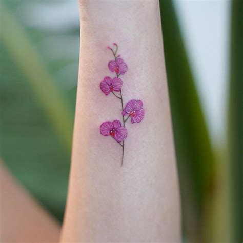 Pink orchids on the forearm.