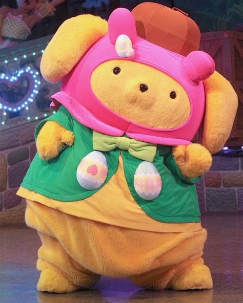 winnie the pooh is dressed up in costume