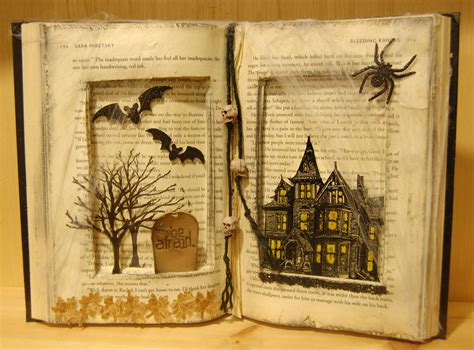 an open book with halloween decorations on it