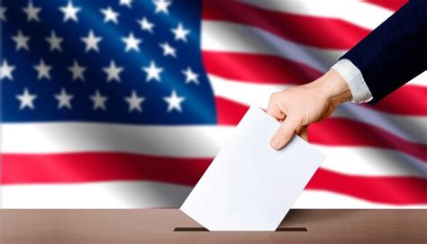 Premium Photo | Hand holding ballot in voting ballot box with USA flag ...