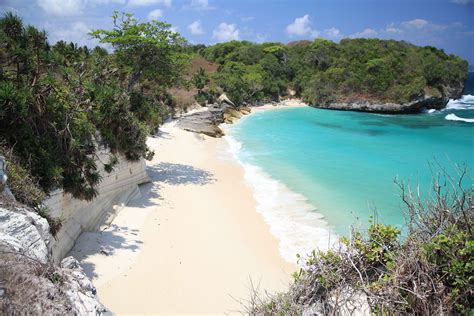 beaches in sumba - beautiful clear preserved ocean in sumba surf camp