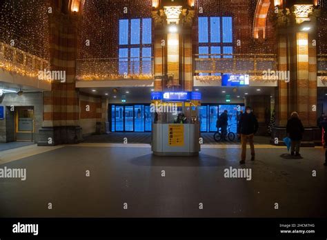 Features and architecture of Amsterdam Central Station in the evening ...