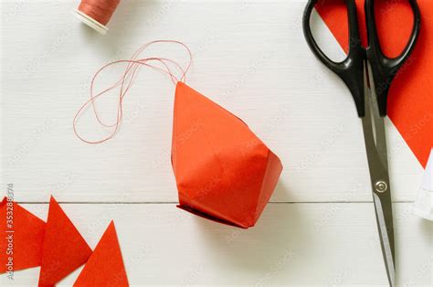 Step by step instructions for making origami paper lantern on christmas ...