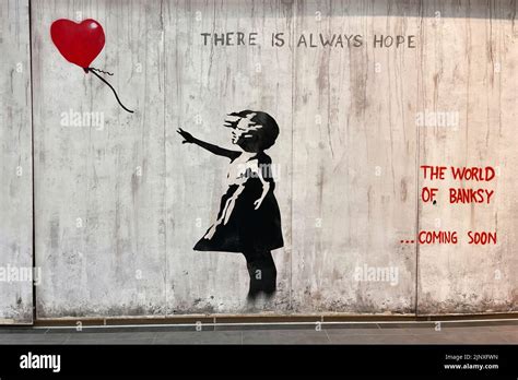 Girl with balloon, reproduction street art work announcing the ...