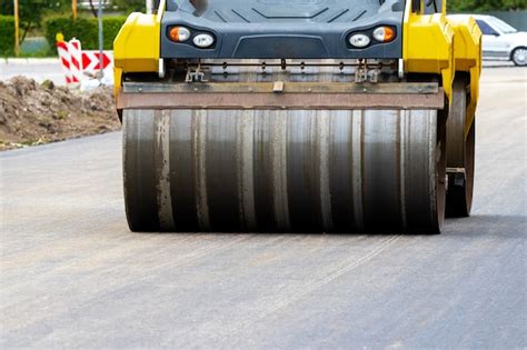 Premium Photo | Asphalt paver on the road during asphalt laying in ...