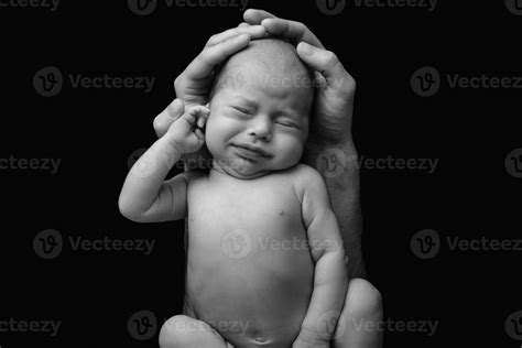 Funny newborn baby in the father's hands 14406229 Stock Photo at Vecteezy