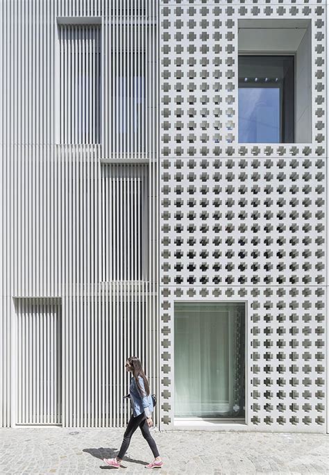 A Cross Pattern Covers This Facade Made From Precast Concrete