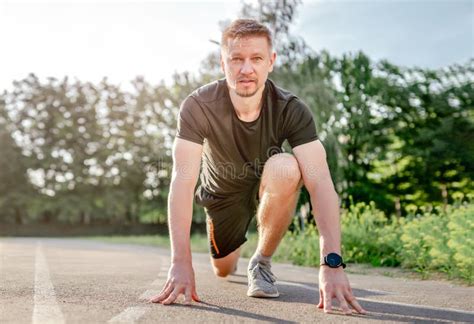 Man doing workout outdoors stock photo. Image of sportswear - 245093358