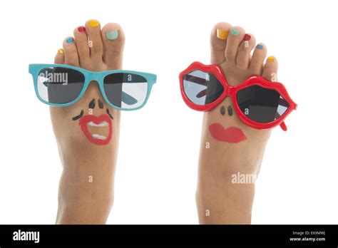 Happy and funny black summer feet with colorful nail polish and ...