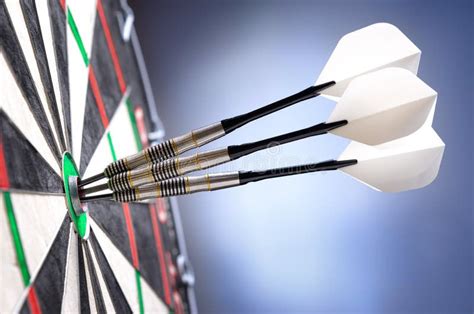 Three darts in bullseye stock image. Image of bullseye - 36225823