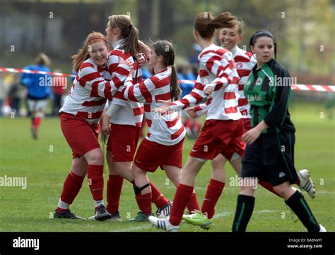 Young female footballers celebrate scoring a goal Stock Photo - Alamy