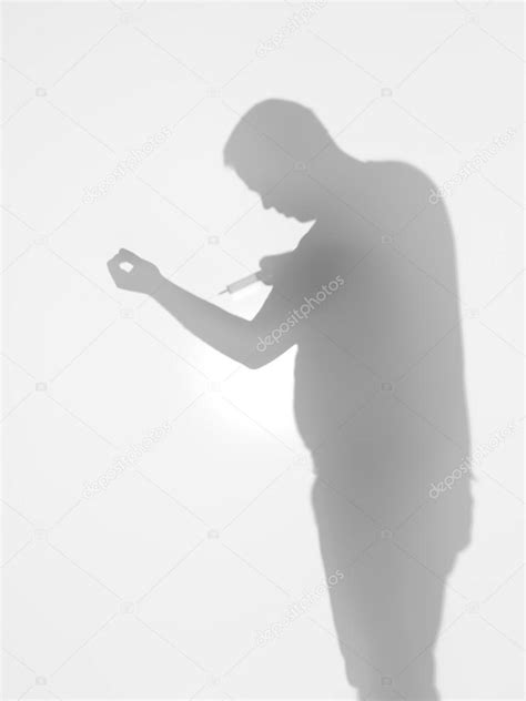 Drug addict holding a syringe, silhouette — Stock Photo © shotsstudio ...