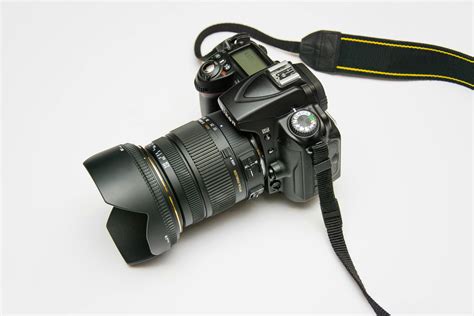 Black Dslr Camera on White Surface · Free Stock Photo