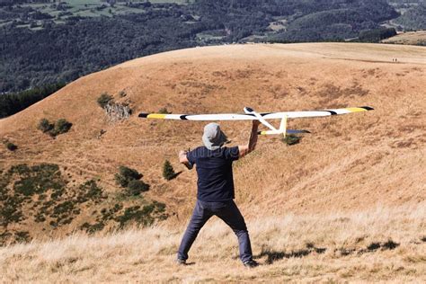 Closeup of a Man Launches a Radio-controlled Model Glider during an ...