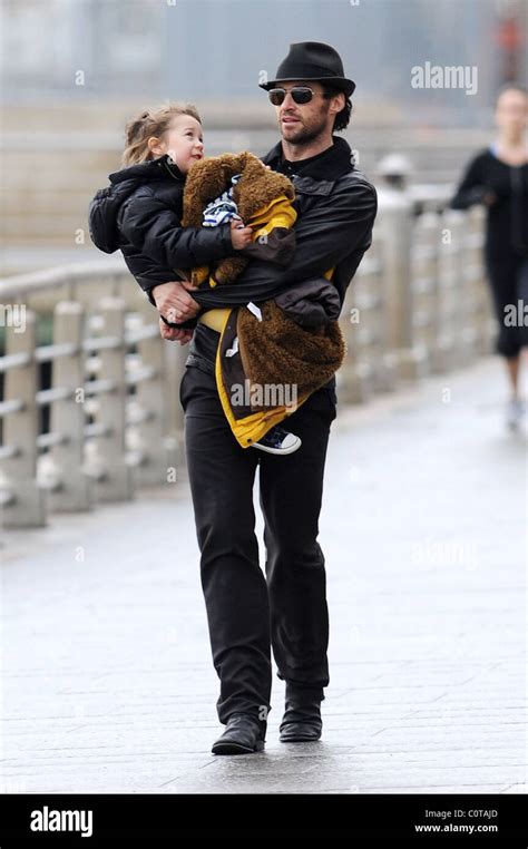 Hugh Jackman playing with his family at the Hudson River Park New York ...