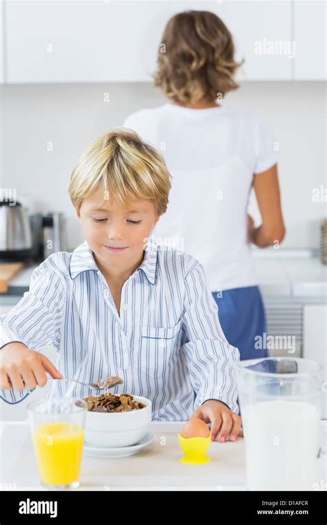 Young boy having breakfast Stock Photo - Alamy