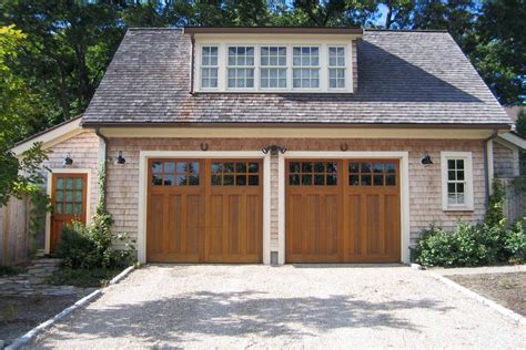 nice 2 car garage design with living space. dormer. wood doors ...