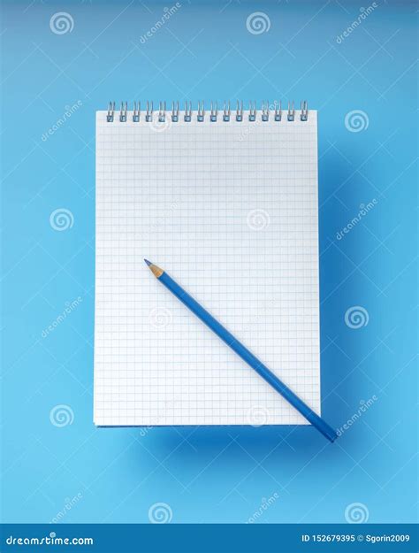 Notebook with a Blank Sheet of Paper and a Blue Pencil Stock Image ...