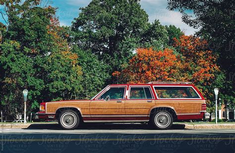 "Vintage American Station Wagon In Red Saddled Up At Parking Space" by ...