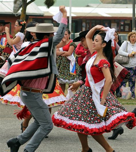 people are dancing and having fun in the street