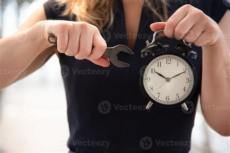 Business woman try to adjust time on alarm clock 3410873 Stock Photo at ...