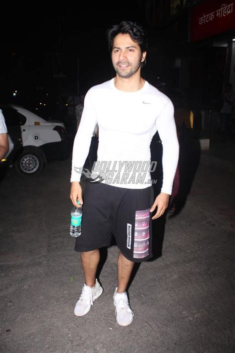 Varun Dhawan smiles and poses for paparazzi post workout