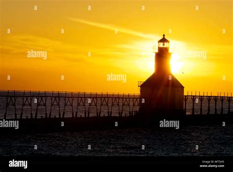 St. Joseph North Pier Lights in St. Joseph, Michigan at sunset Stock ...