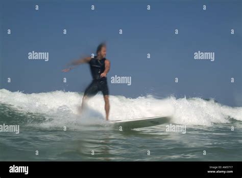 Man surfing waves at Le Porge beach, Bordeaux, France Stock Photo - Alamy