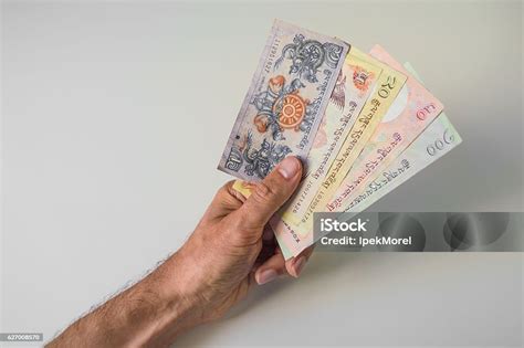 Man Holding A Bunch Of Bhutanese Ngultrum Banknotes Stock Photo ...