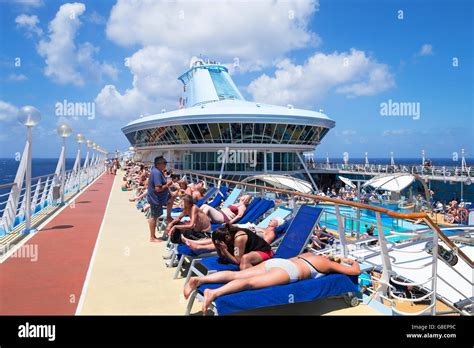 Passengers relaxing on board the cruise ship Discovery that belongs to ...