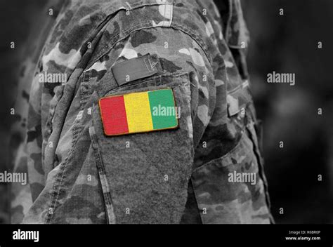 Republic of Guinea flag on soldiers arm. Guinea flag on military ...